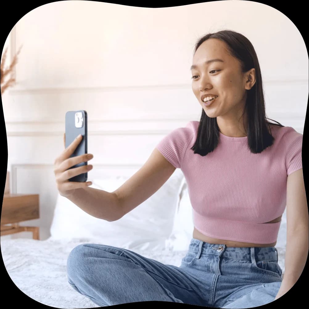 Patient holding up phone in a video call
