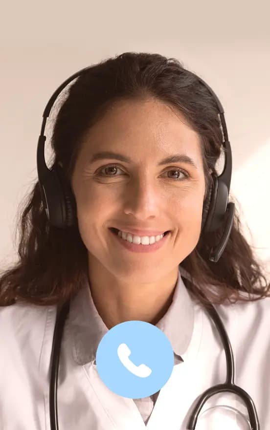 Smiling female doctor wearing a headset during a video call
